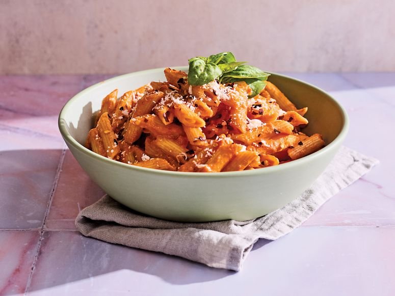 Penne alla Nada with cheese and basil in a bowl